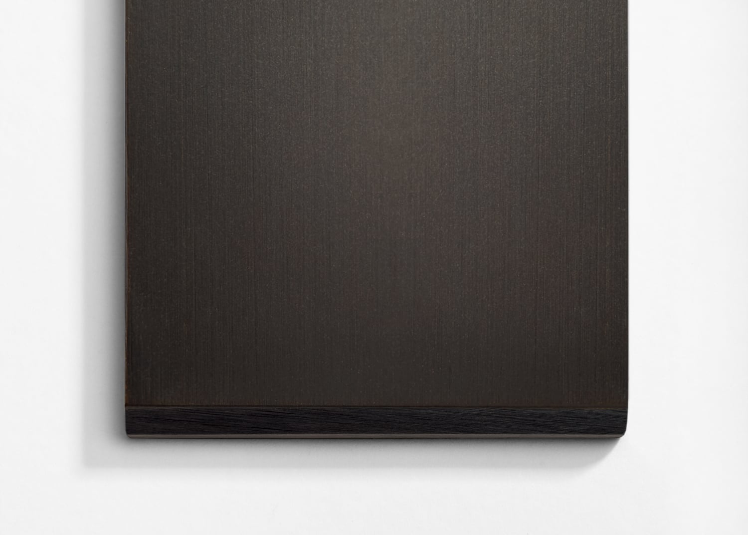 A black wooden frame hanging on a white wall.