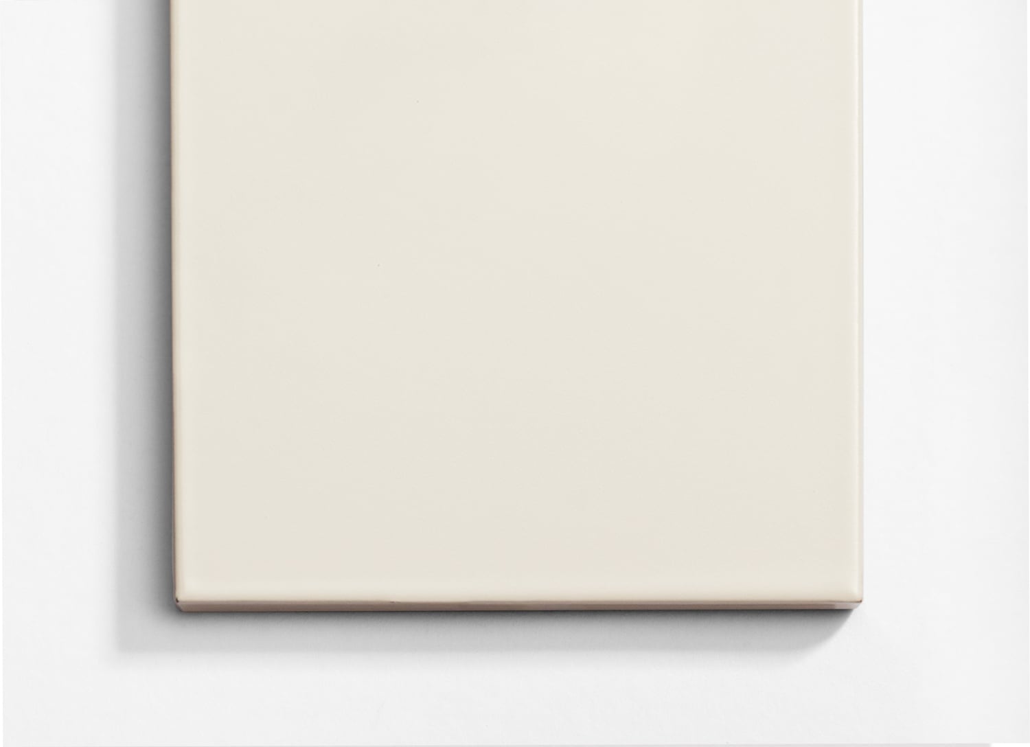 A white square on a white surface.
