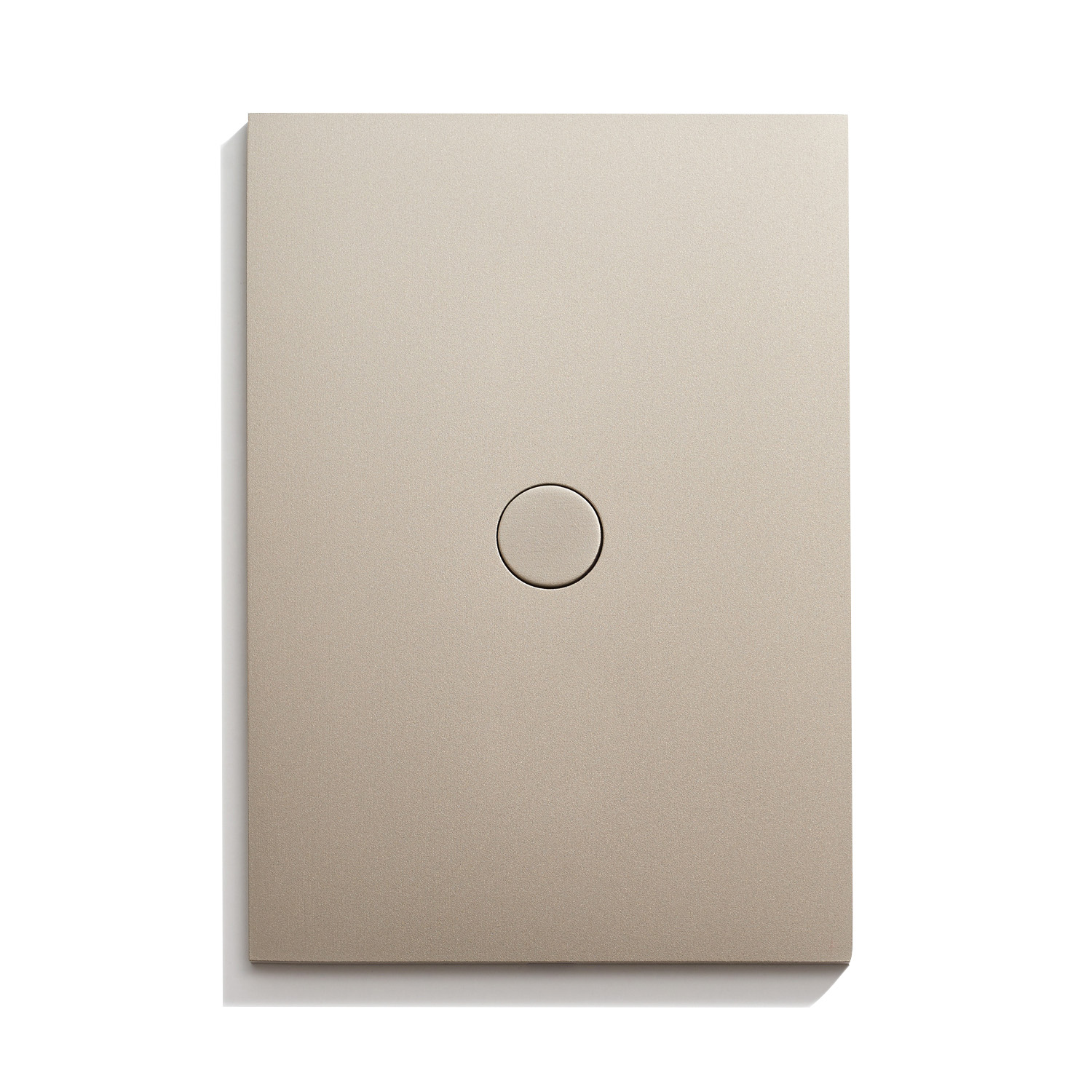 A beige light switch on a white surface.