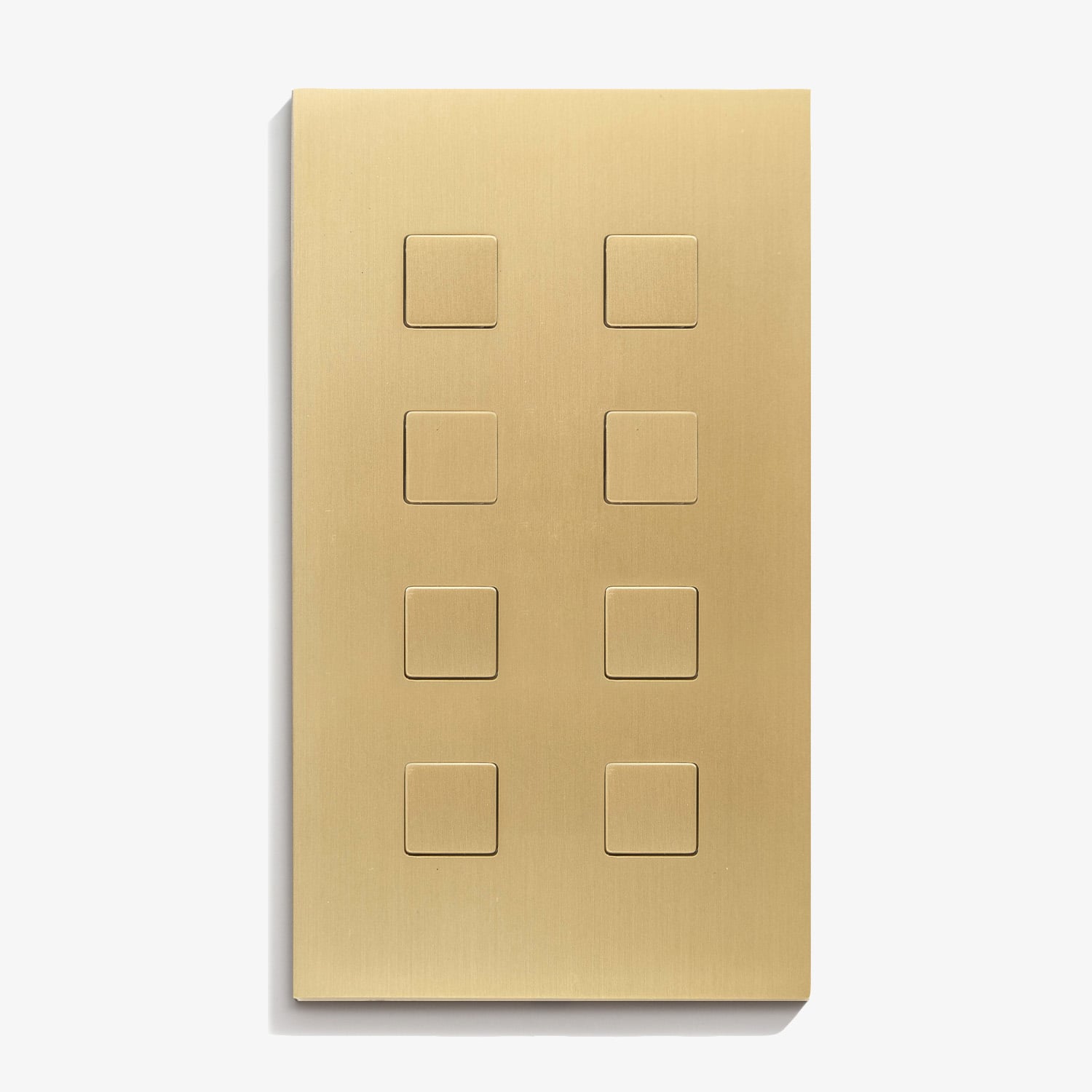 A brass plate with four squares on it.