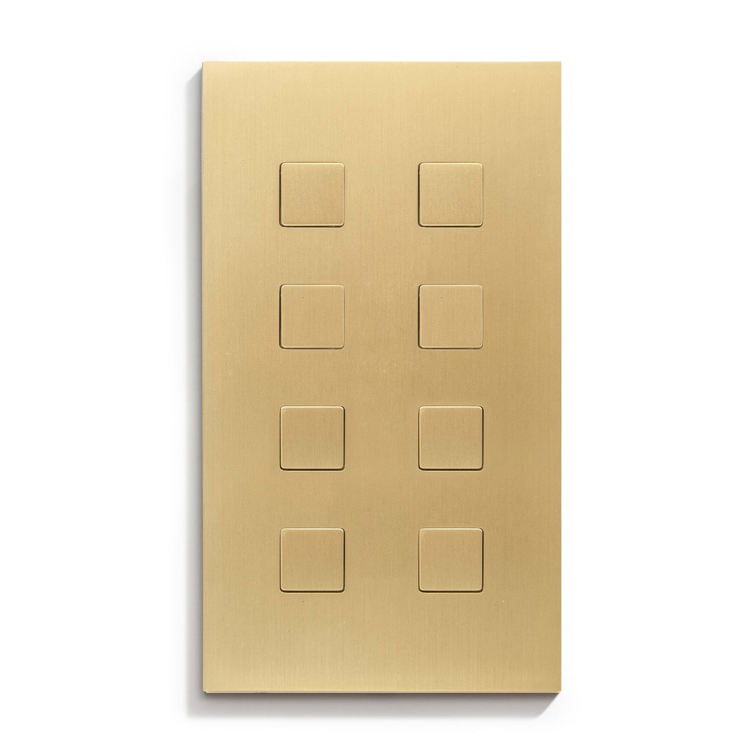 A brass plate with four squares on it.