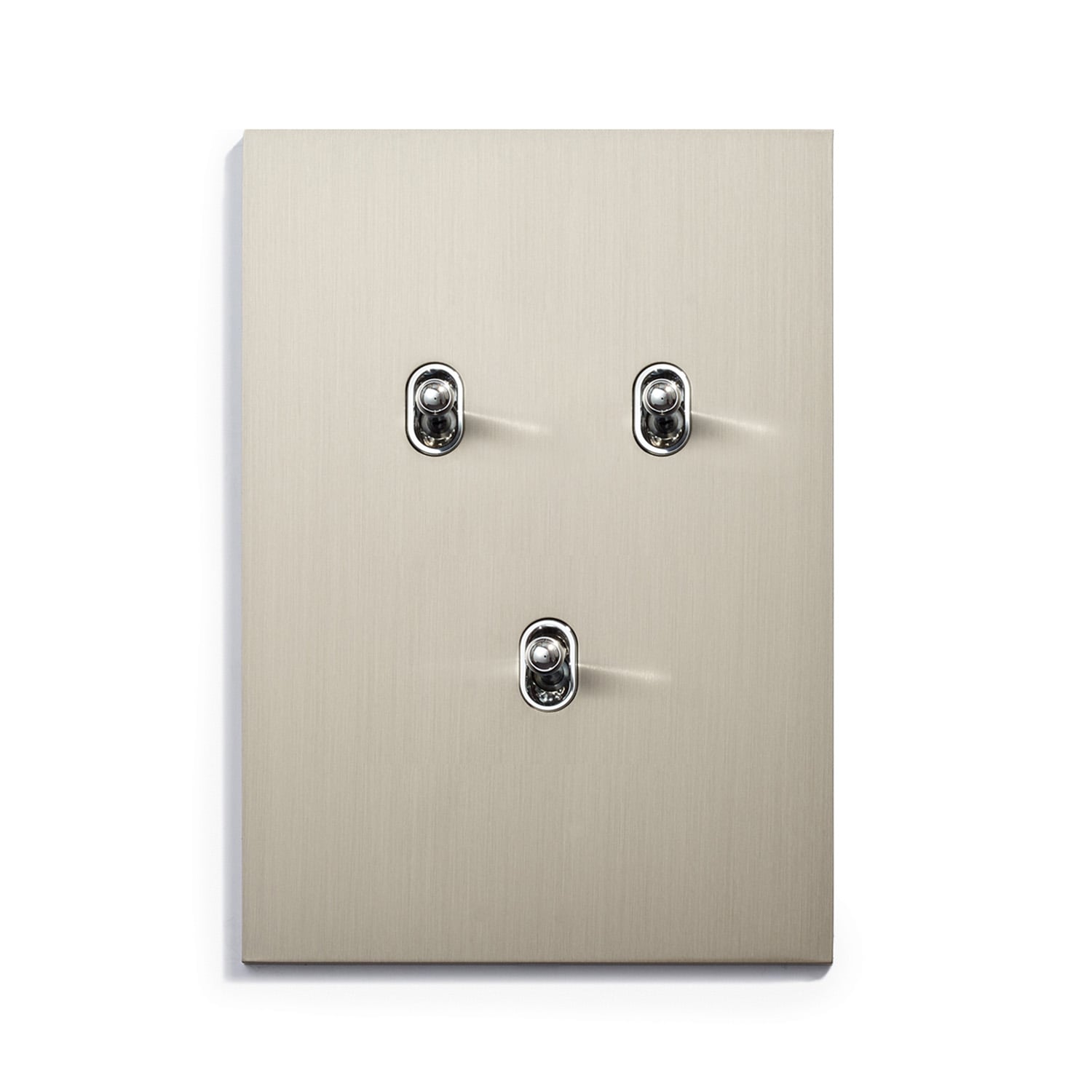 A wall plate with three switches on it.