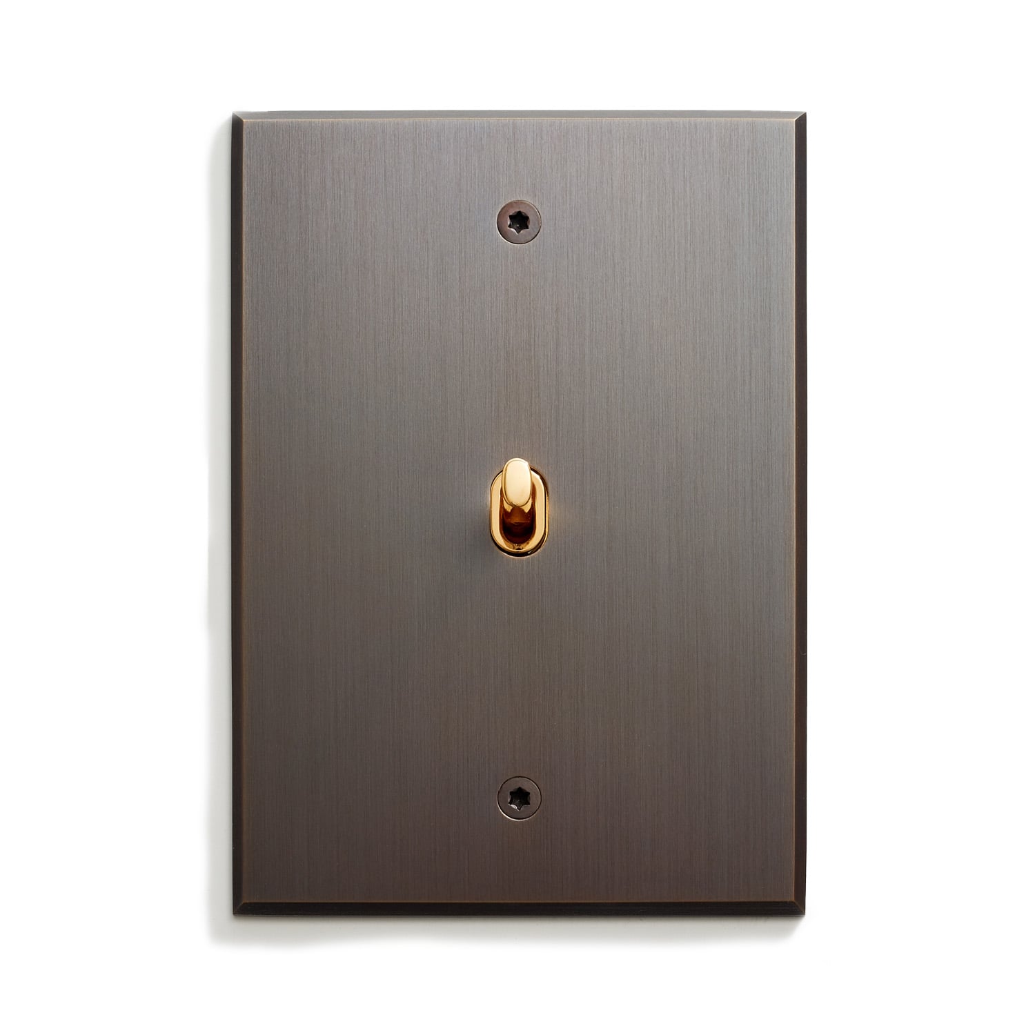 A light switch with a gold knob on it.