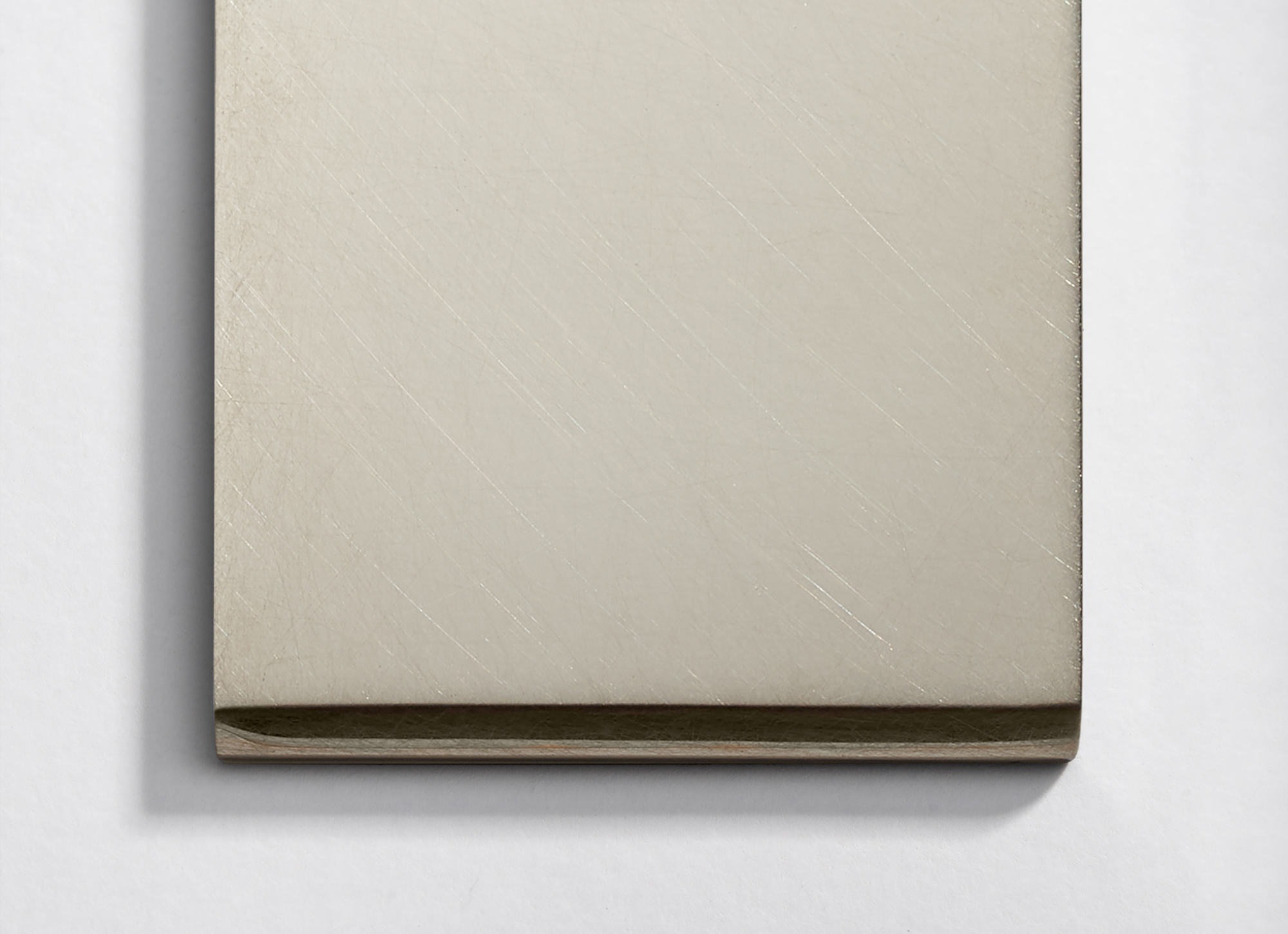 A closed blank notebook with a textured cover on a white background.