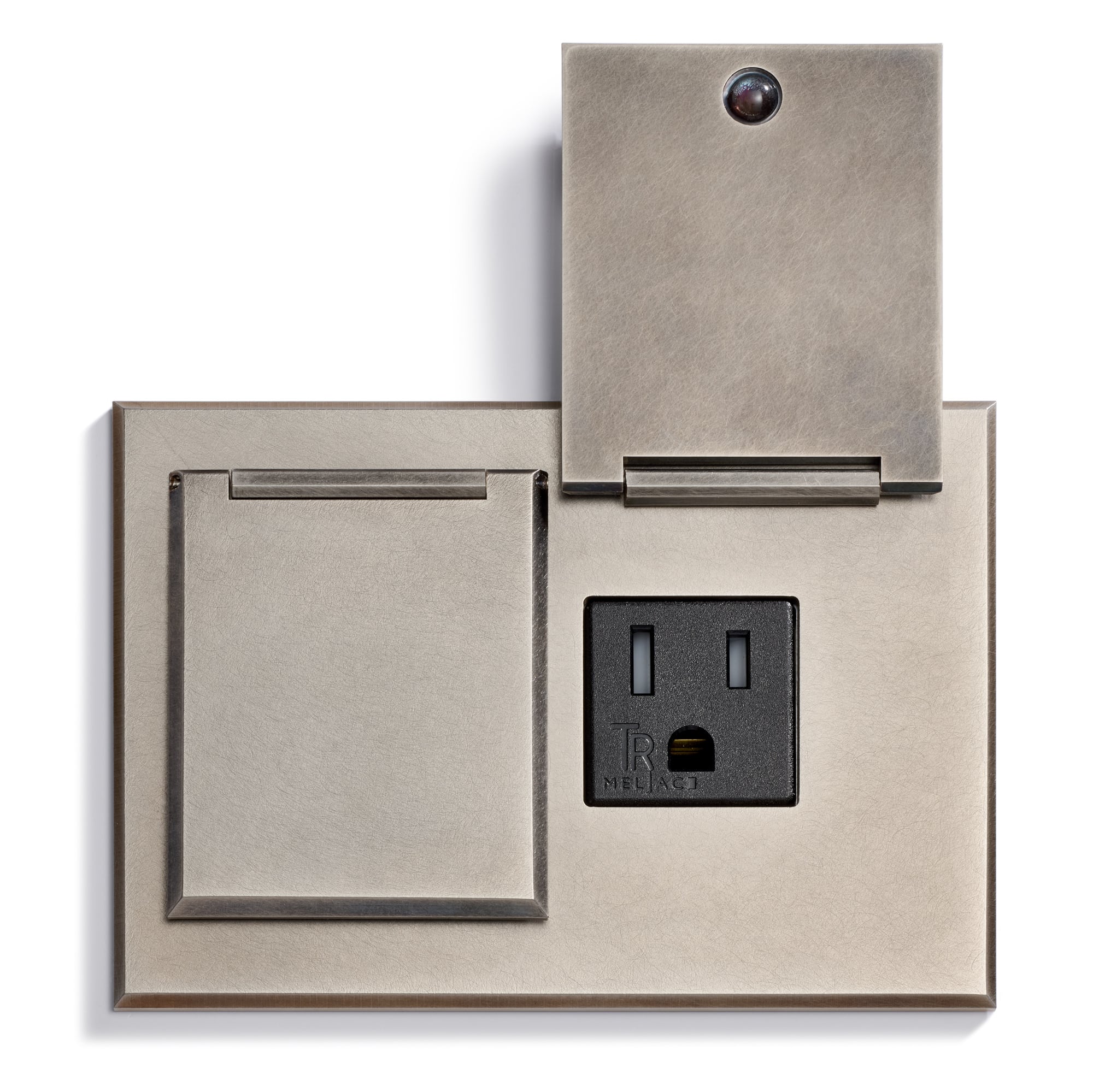 A metallic wall plate with two covered sections; one cover is open, revealing a standard electrical outlet, and the other cover is closed. The design is sleek and modern, featuring a brushed metal finish.