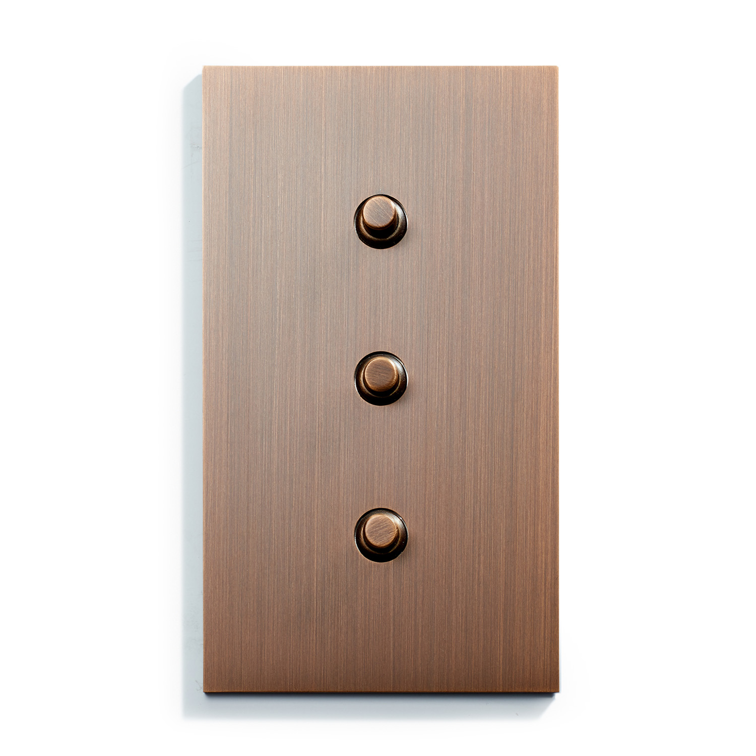 A light switch with three buttons on a white background.