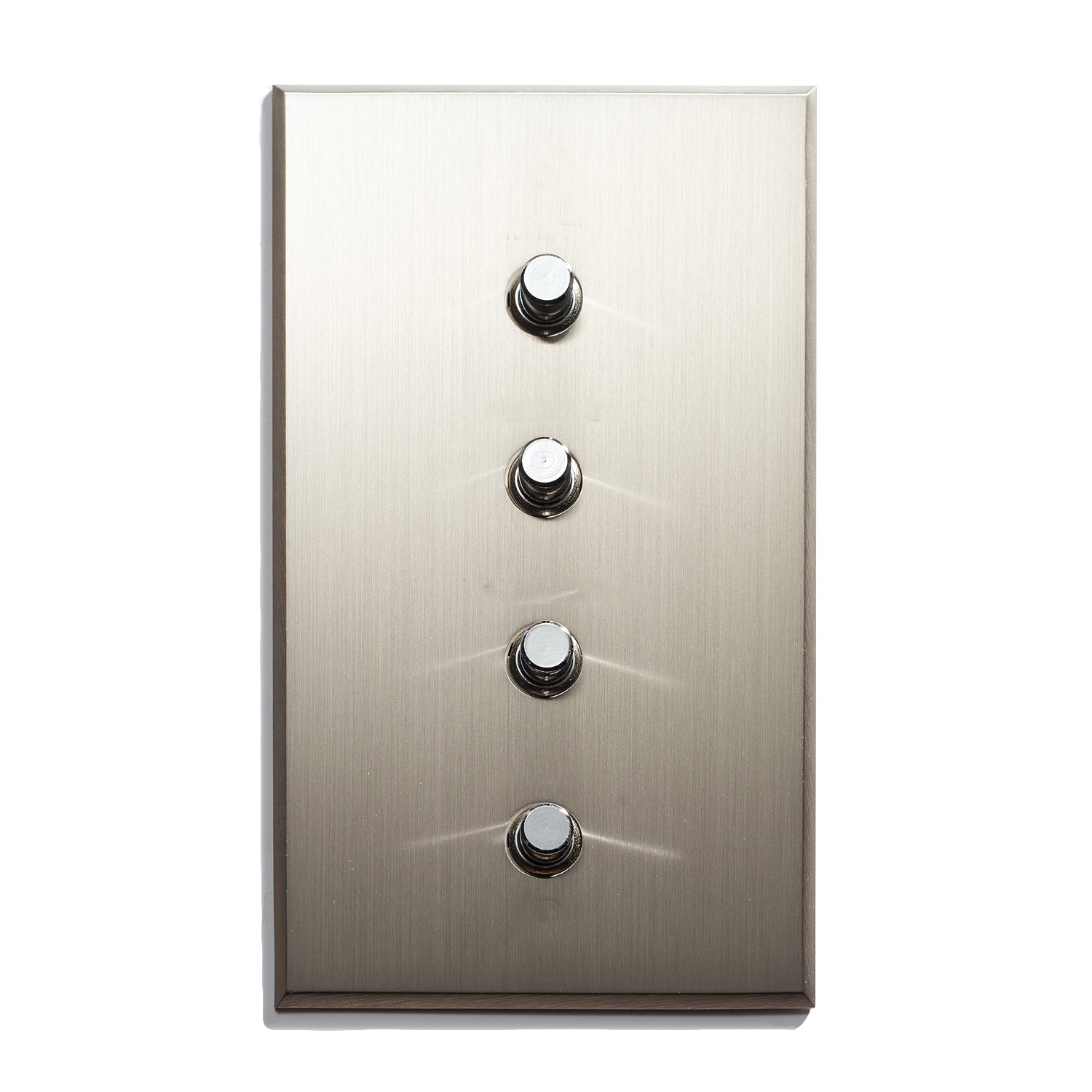 A metal switch plate with four buttons on it.