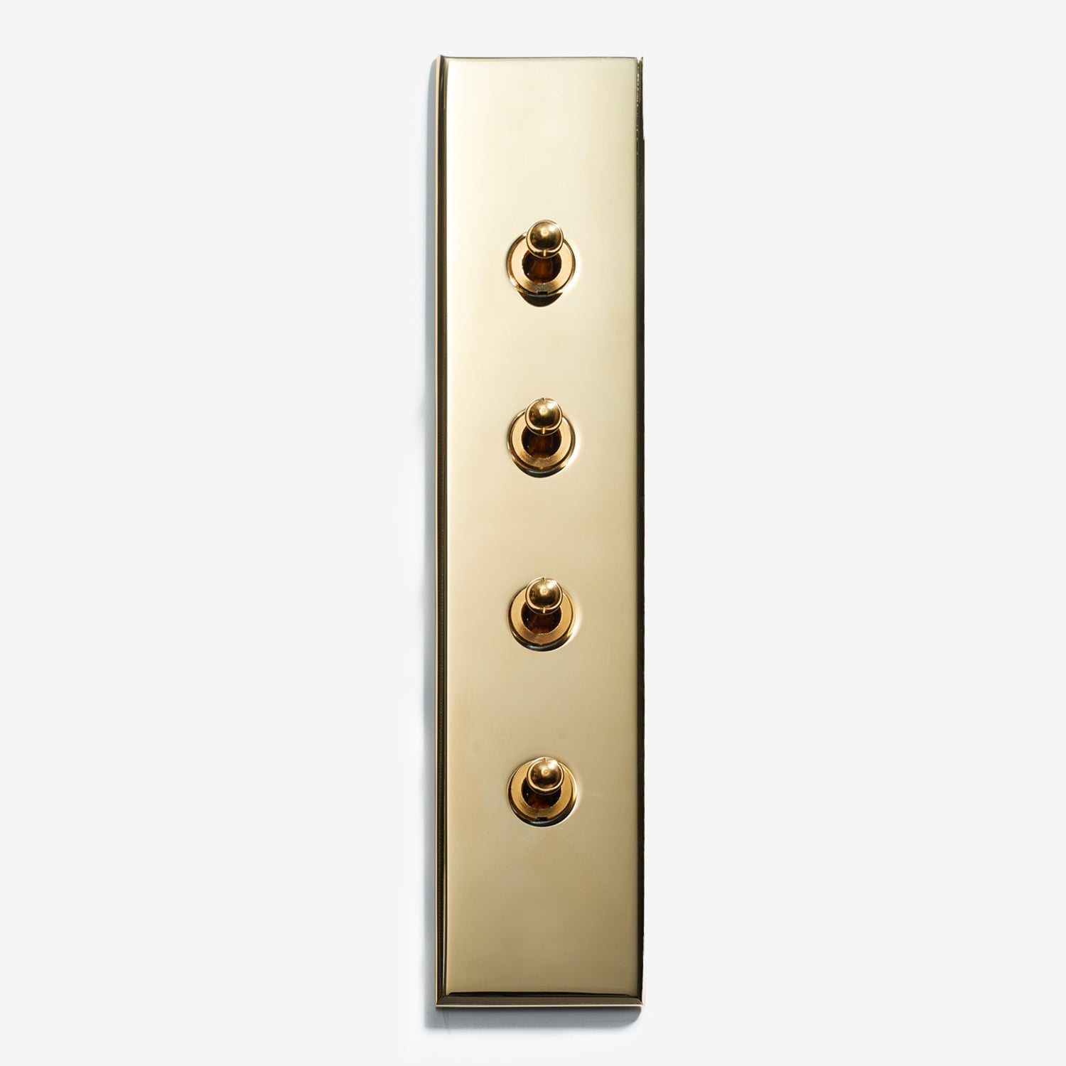 A brass plate with four buttons on it.