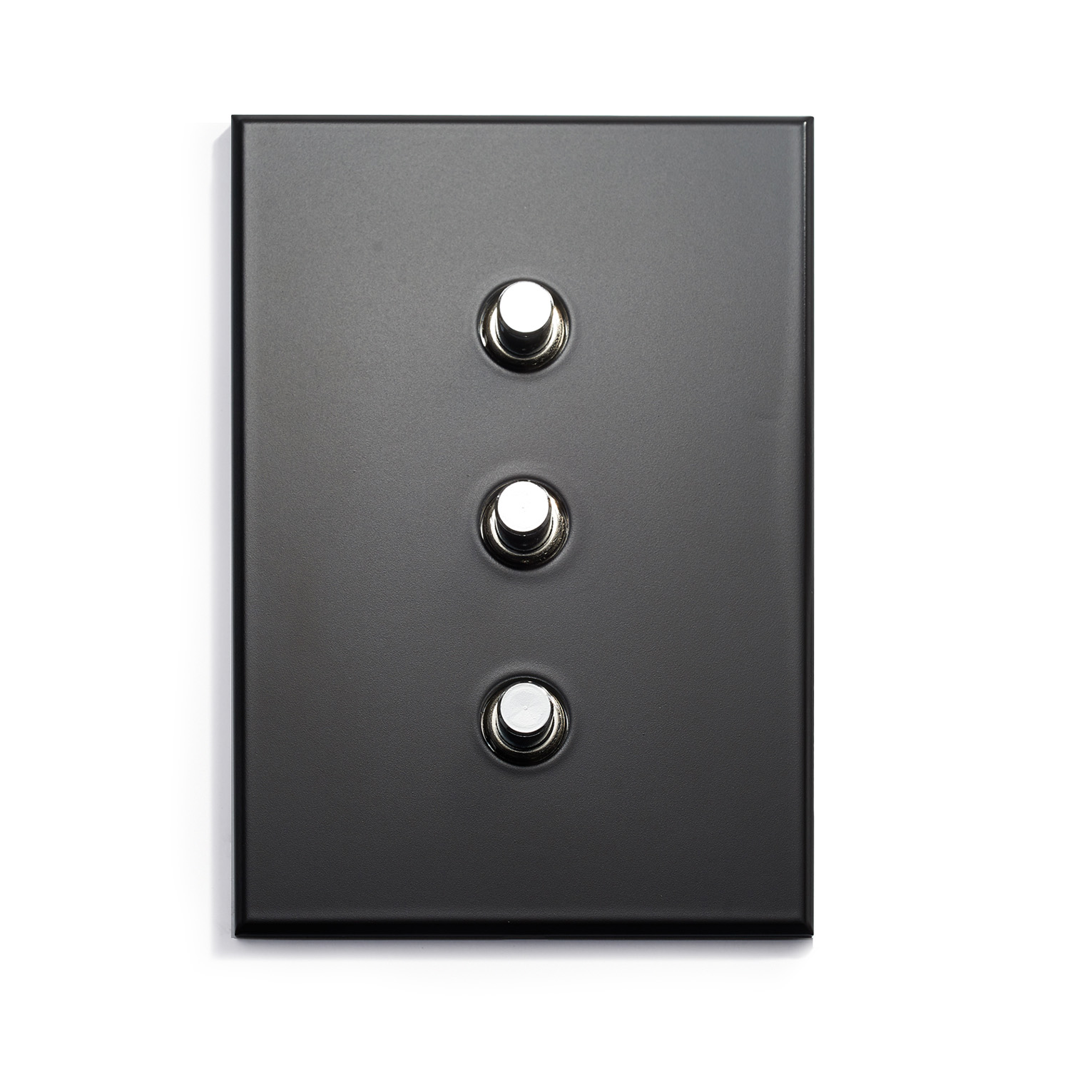 A black switch plate with three buttons on it.