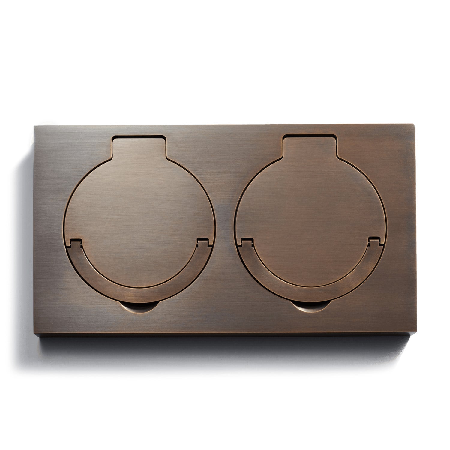 A metal box with two circular openings on a white surface.