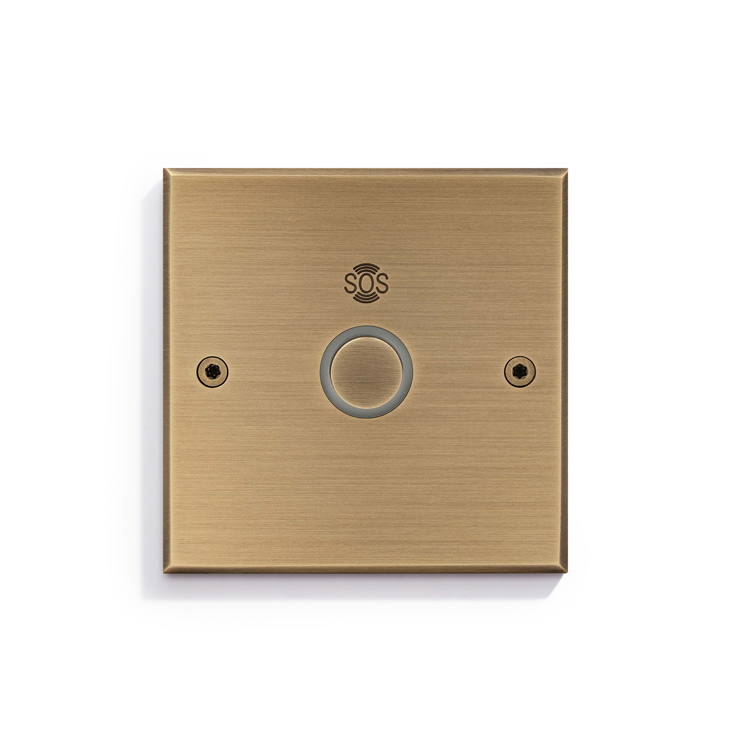 Gold-toned emergency sos button mounted on a wall.