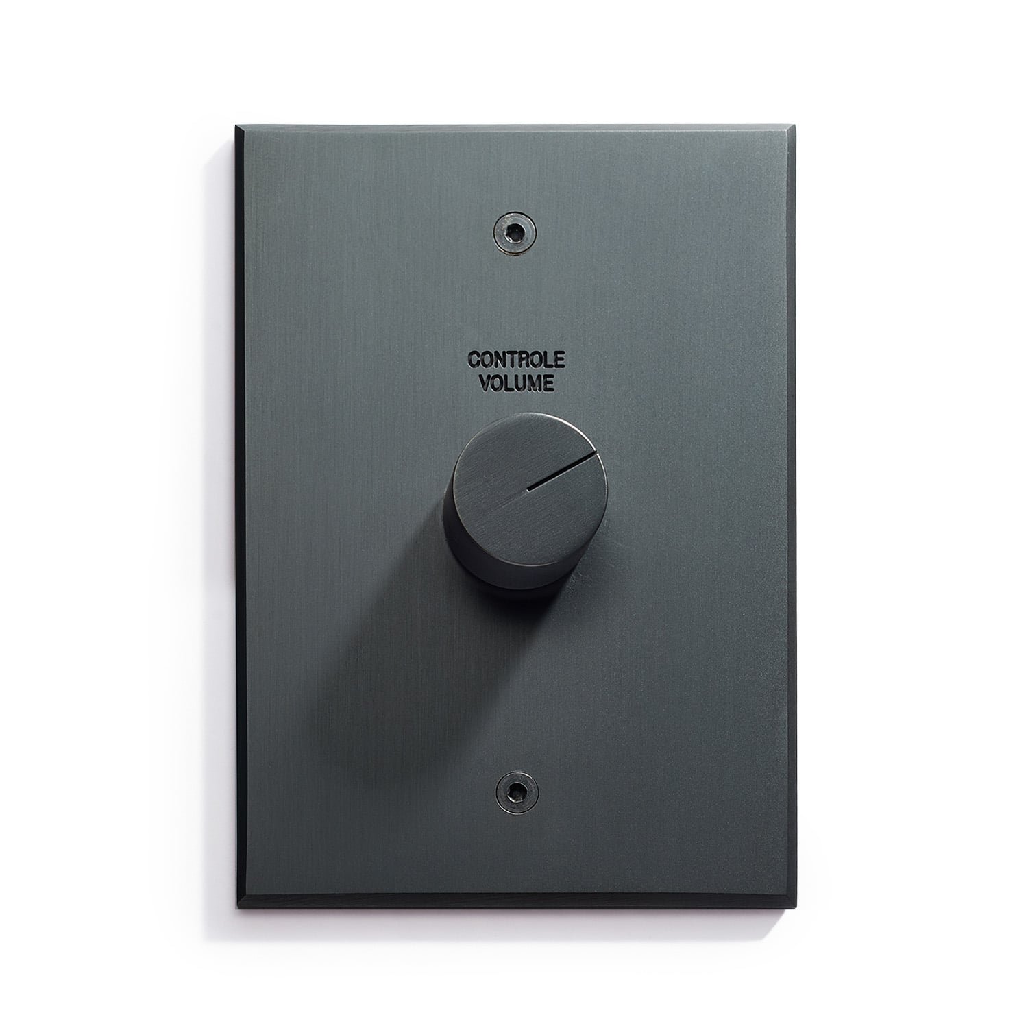 A modern and sleek volume control knob on a dark wall panel.