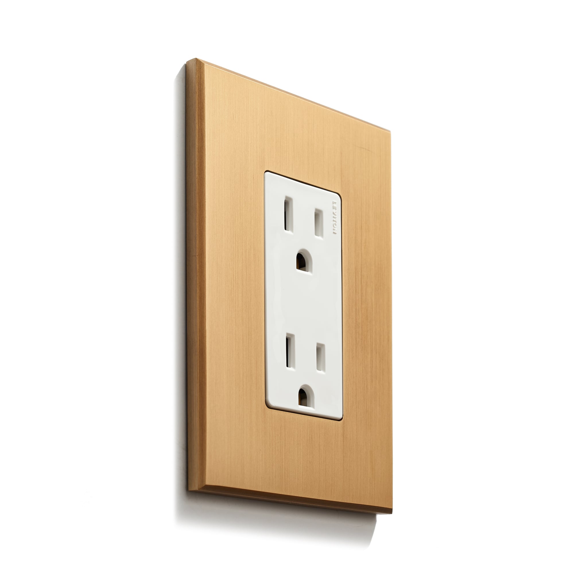 Modern electrical outlet with a wooden-look faceplate on a white wall.