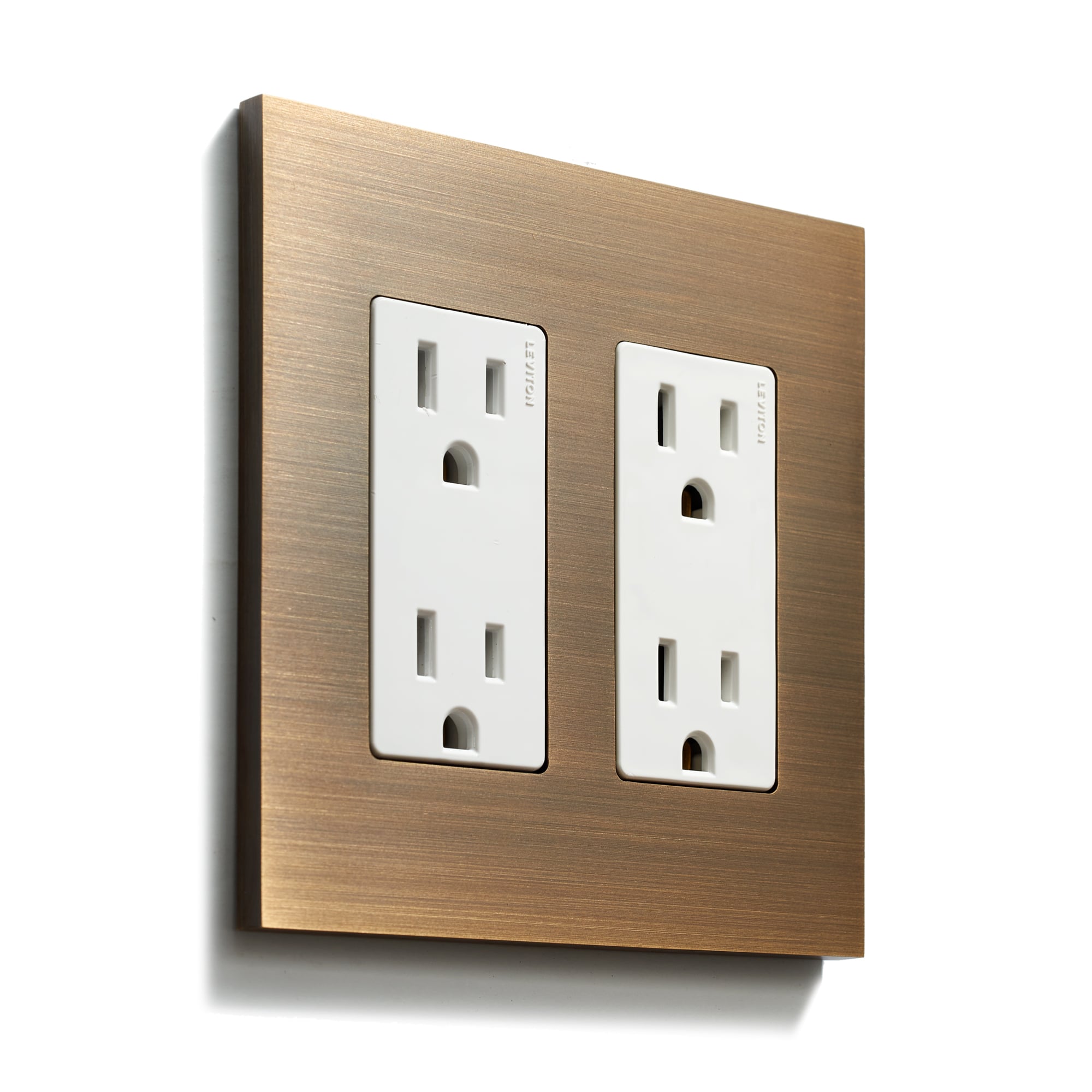 Modern dual electrical outlets on a bronze-colored wall plate.
