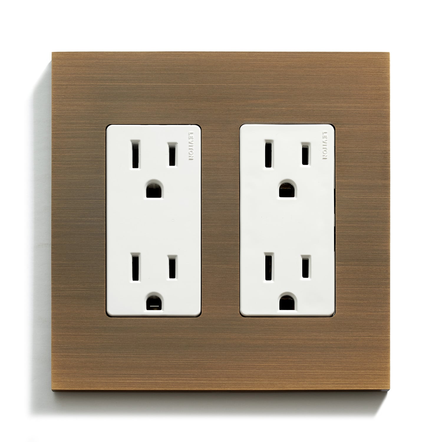 A modern dual electrical outlet with a white cover mounted on a wooden base.