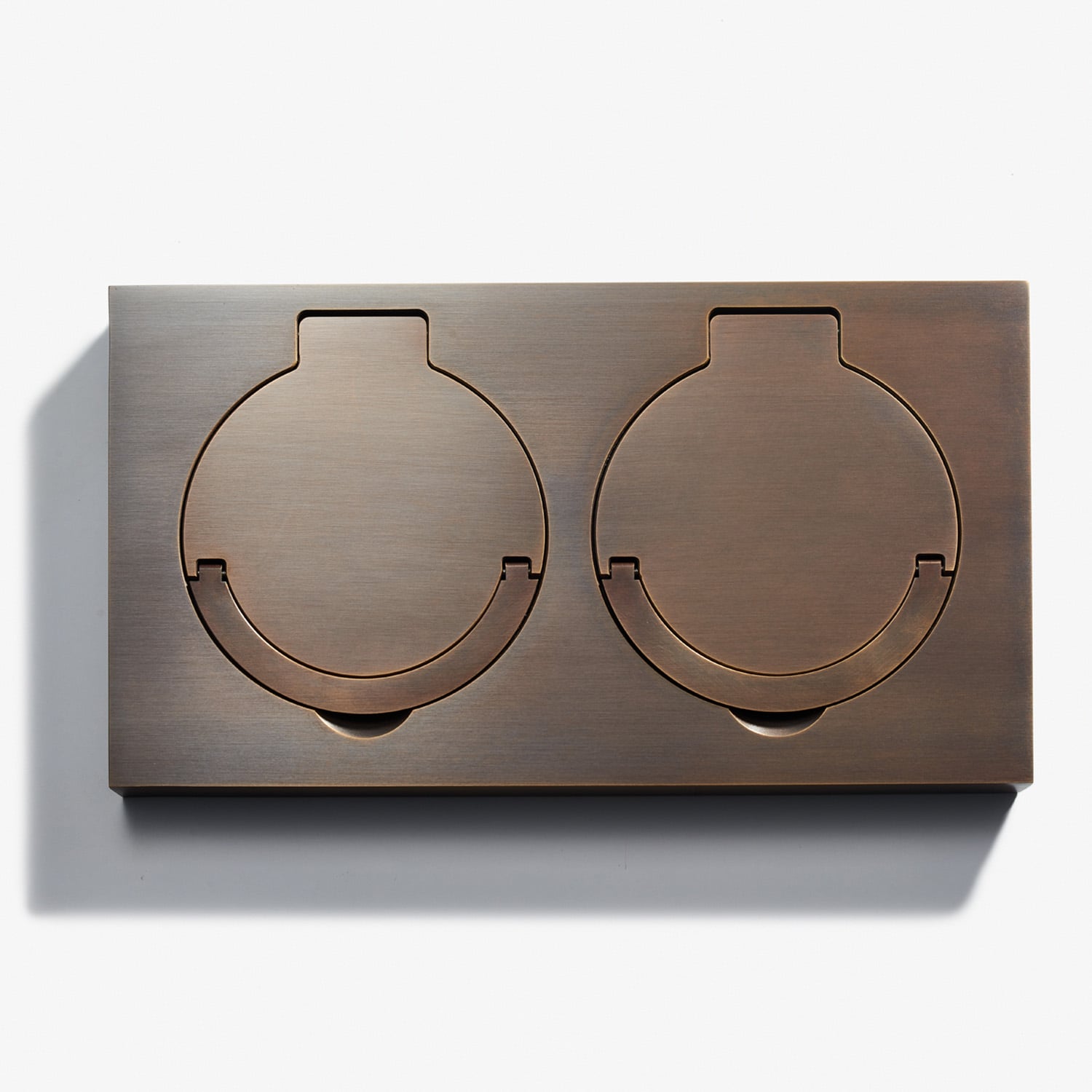 Sleek bronze double stove burner covers on a white background.