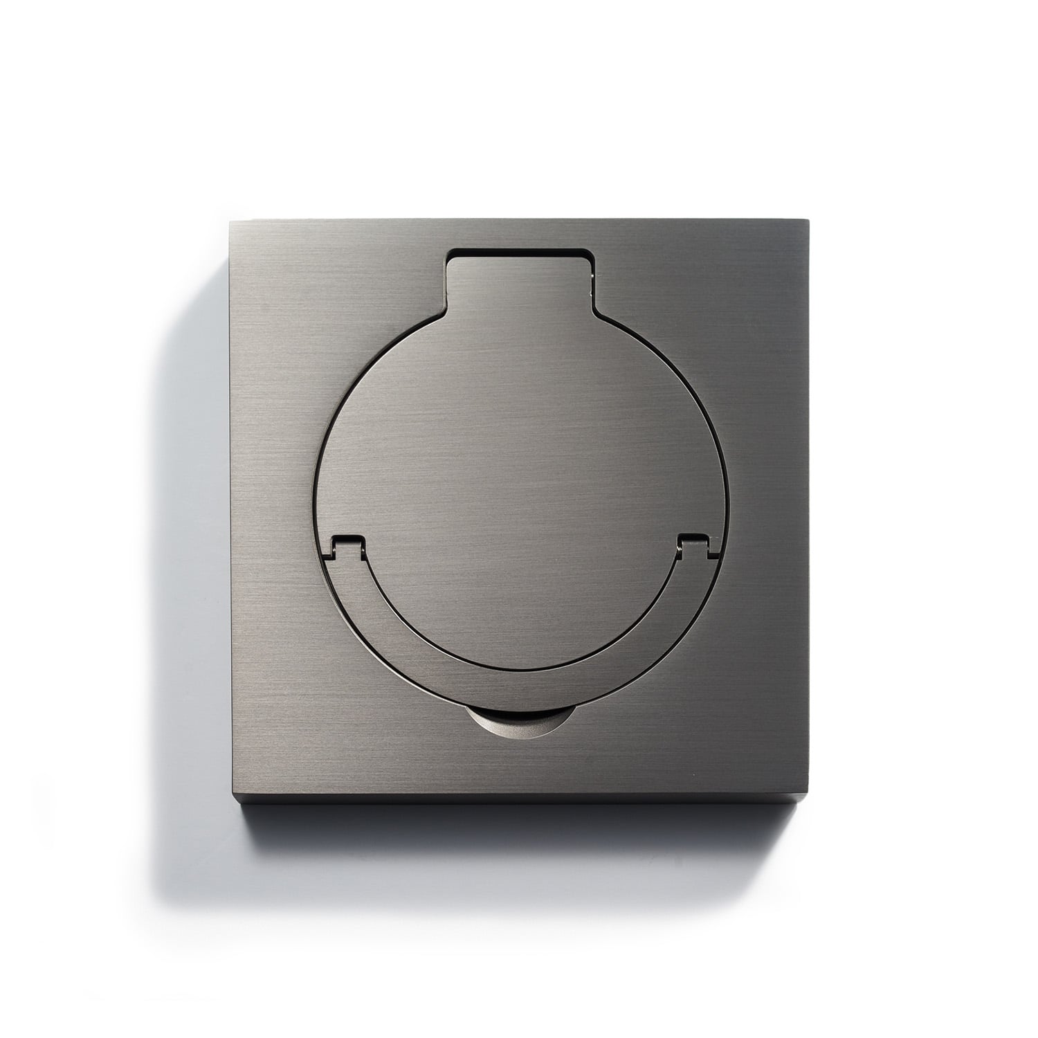 Modern stainless steel wall plate with circular cutout, showcasing a minimalist design.