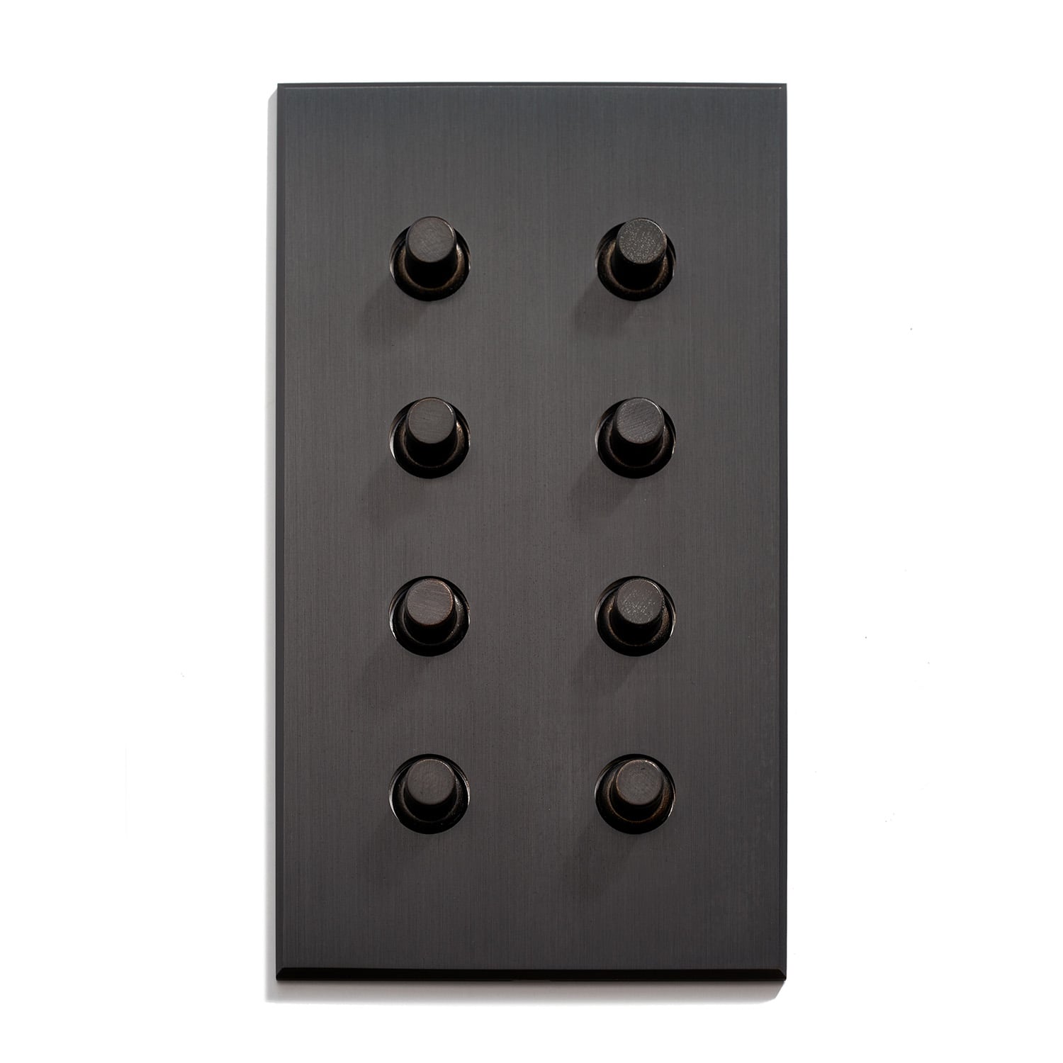 Black panel with an array of nine knobs against a white background.