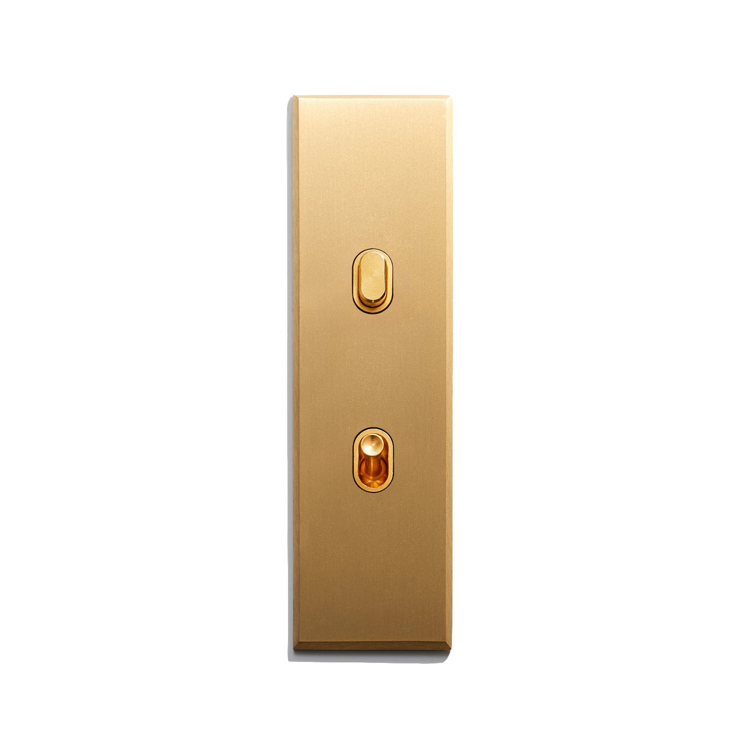 A luxurious gold-colored elevator panel with two buttons, likely indicating an up and a down button for elevator operation.