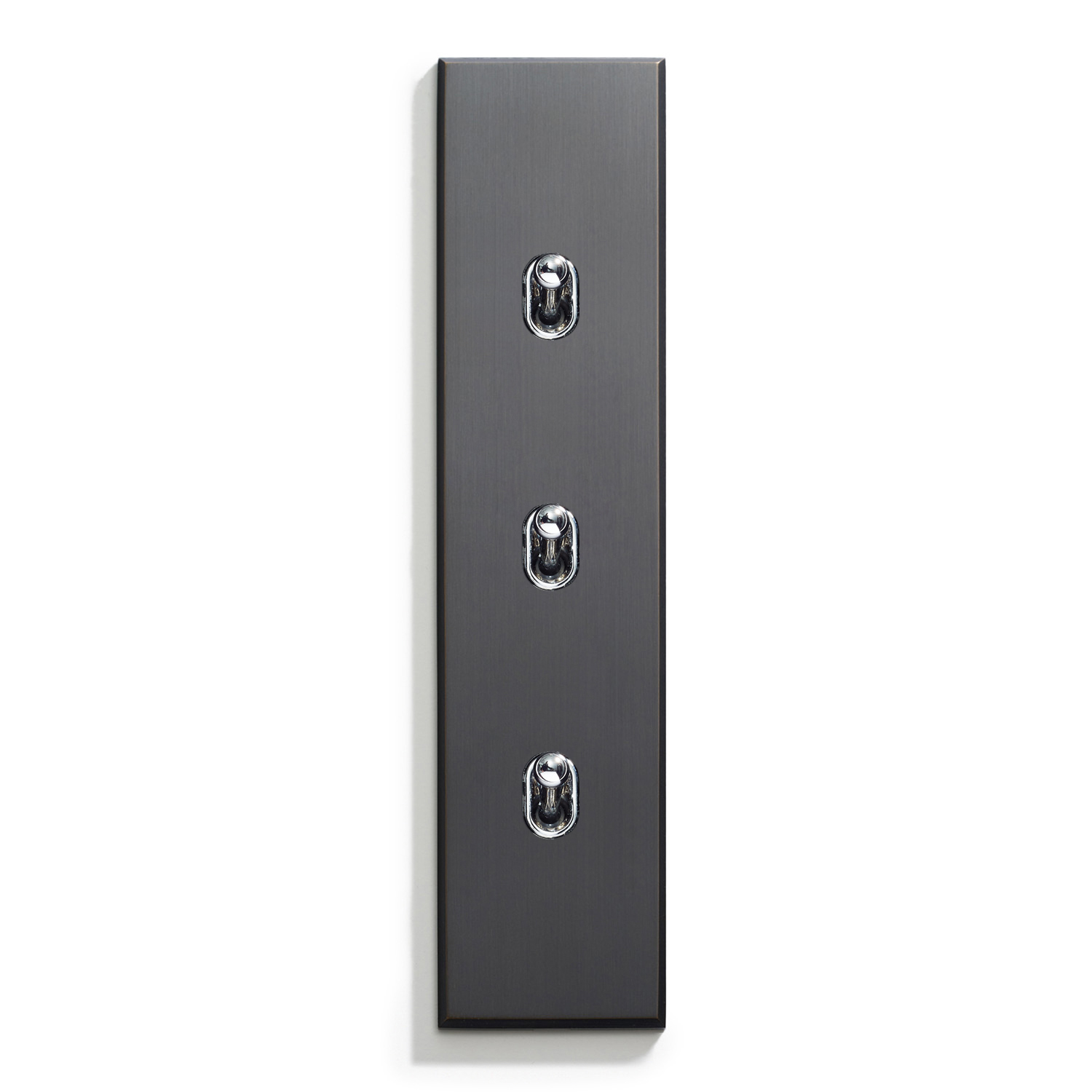 A modern triple light switch with a sleek black finish, mounted on a white wall.