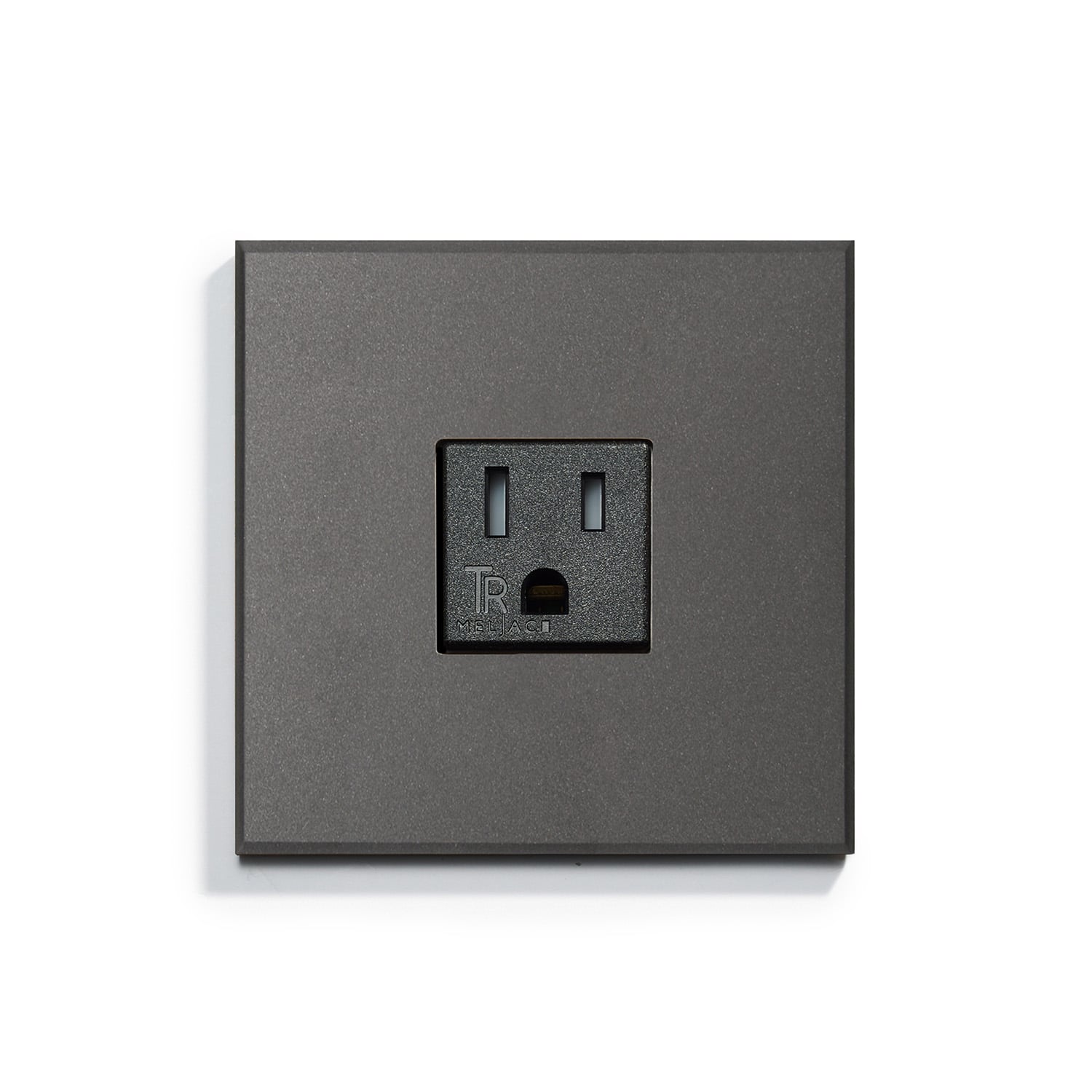 Modern black wall outlet on a matching black wall plate.
