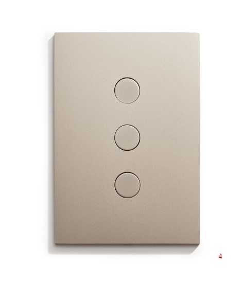 A light switch with four buttons on a white surface.