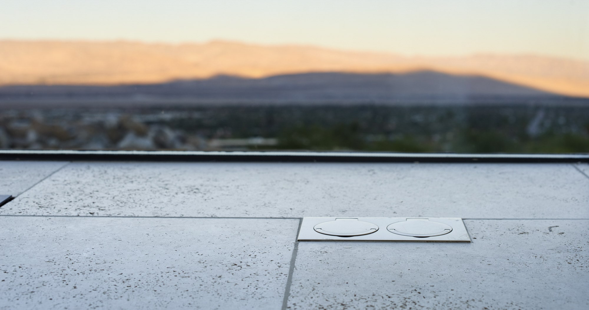 A bathroom with a view of the mountains.
