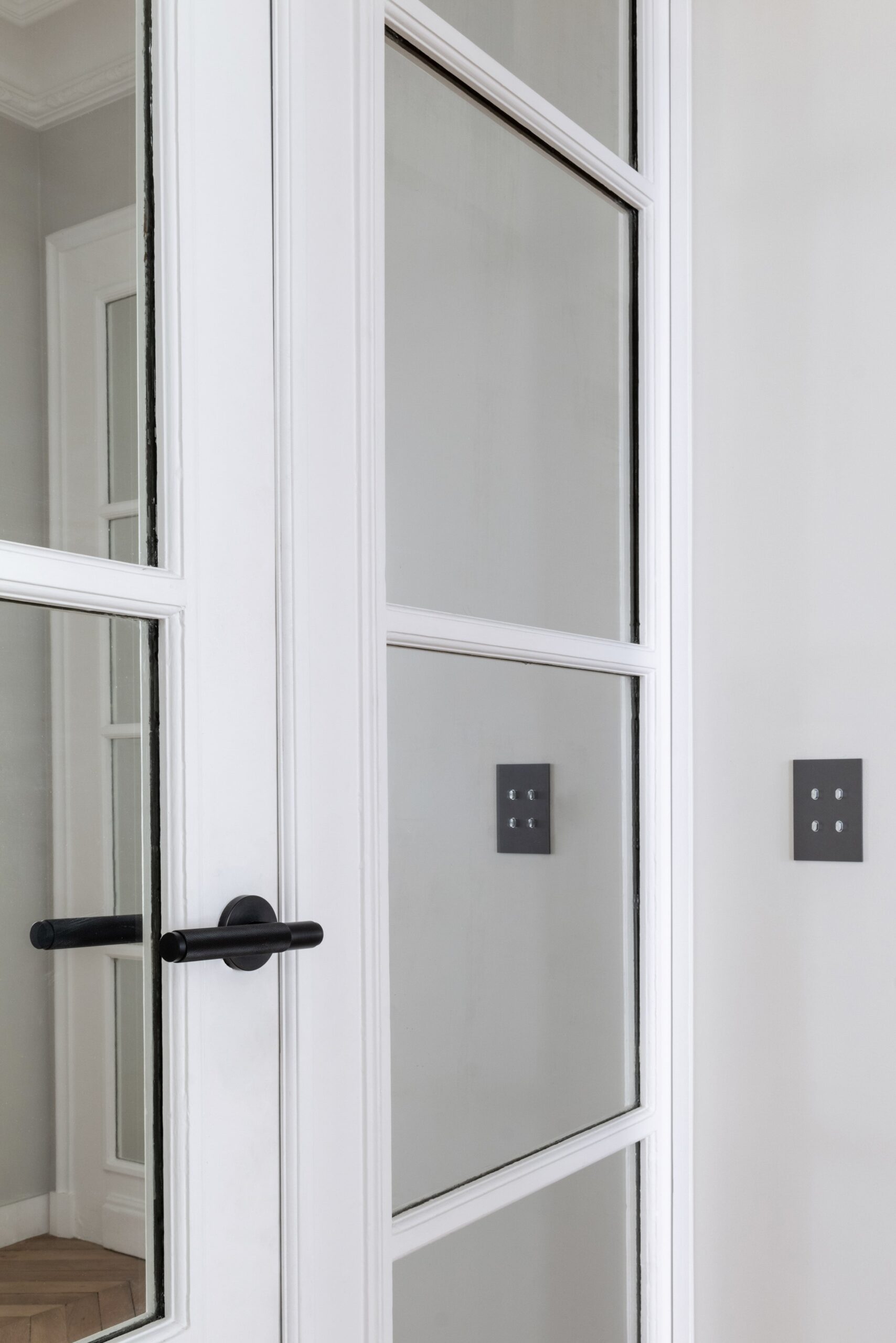 A white door with a black handle.