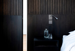 A bed with a white sheet on it.