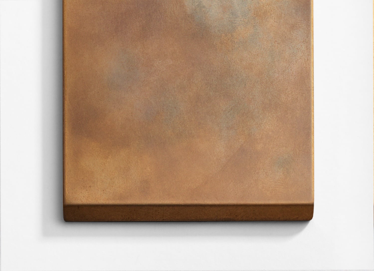 A brown canvas hanging on a white wall.