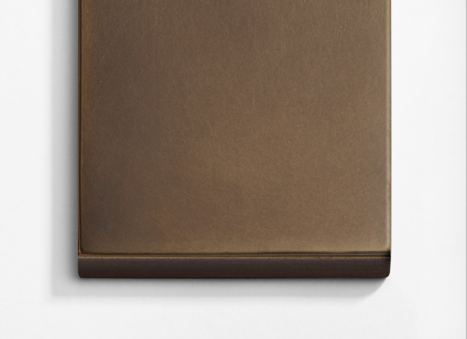 A brown square on a white surface.