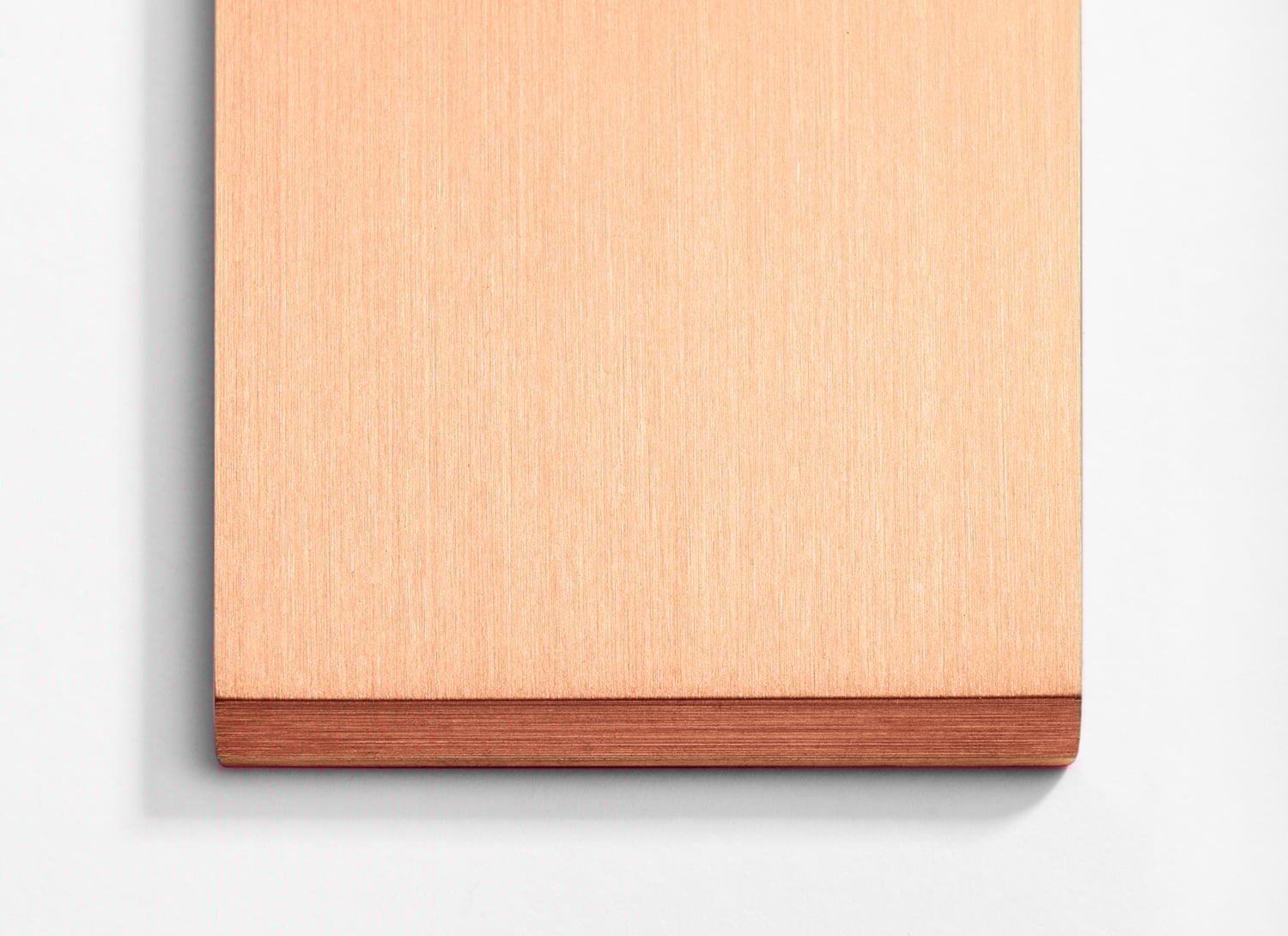 A copper plate on a white surface.