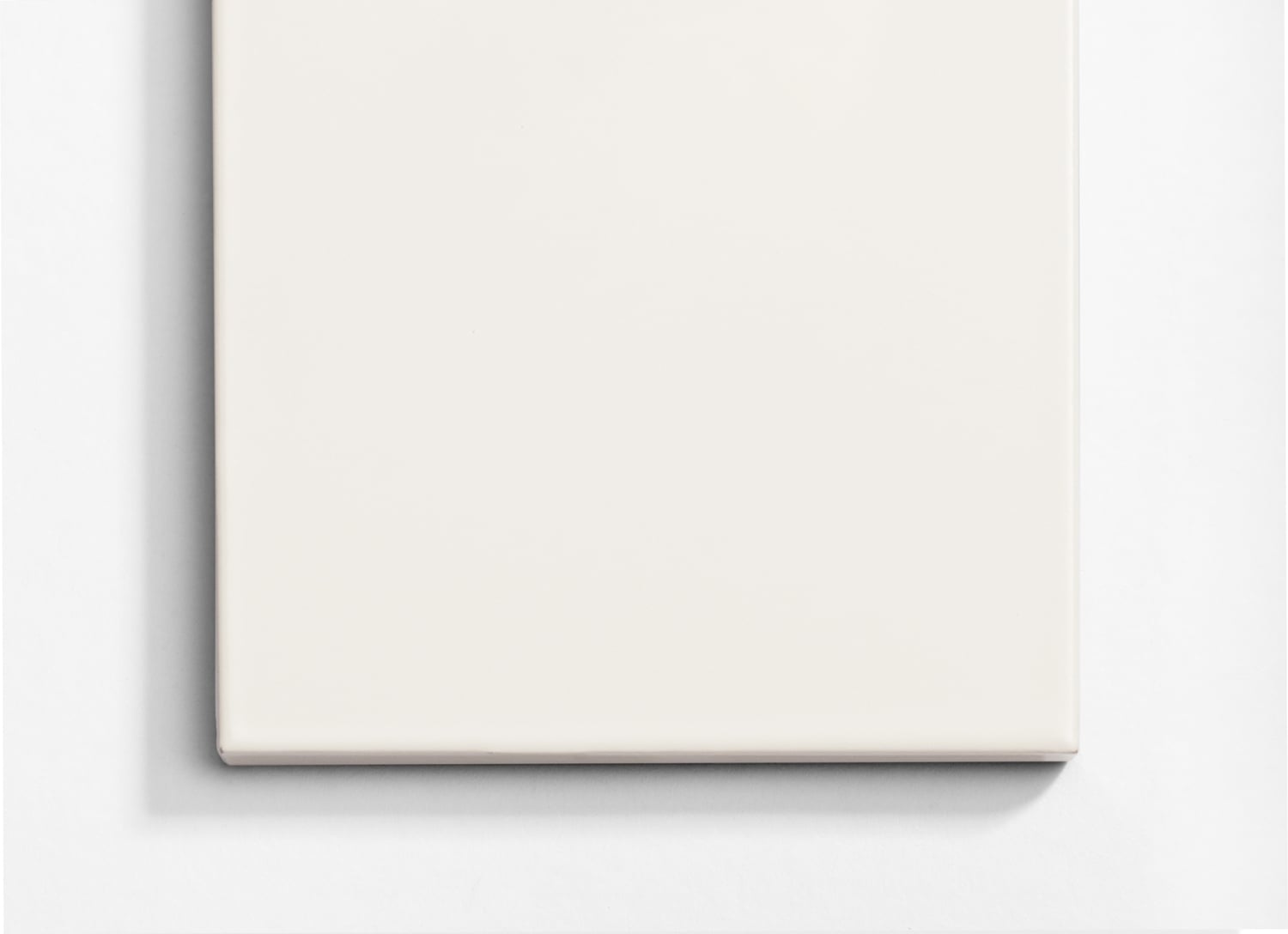 A white square on a white surface.