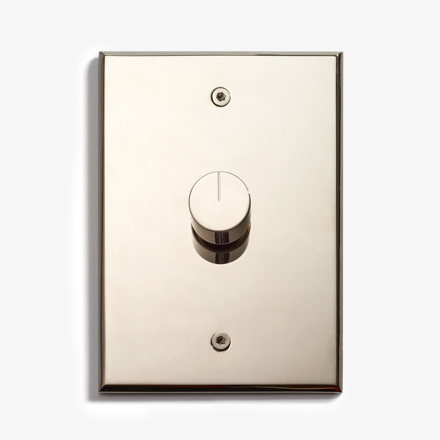 A shiny, metallic light switch plate with a single round dimmer knob in the center, mounted on a white wall. The plate has two visible screws, one above and one below the knob.